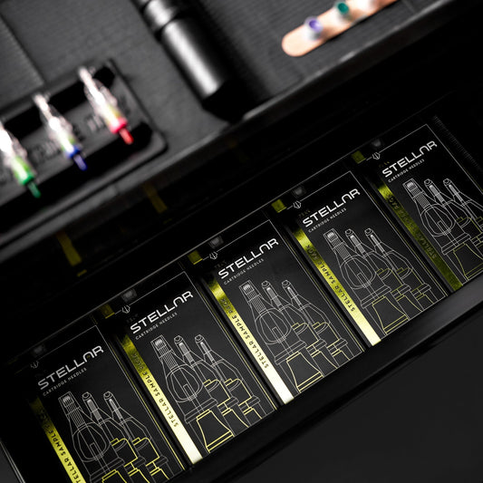 Neatly organized workstation drawer properly storing flat boxes of Stellar tattoo needle cartridges.
