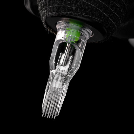 Tattoo machine equipped with a flat needle cartridge, ready to push ink using optimized stroke mechanics and voltage settings.