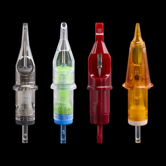 Four different Peak tattoo needle cartridges lined up vertically against a black background, showcasing clear, neon green, deep red, and amber-orange plastic casings.