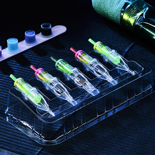 A row of five tattoo needle cartridges in a clear plastic tray.