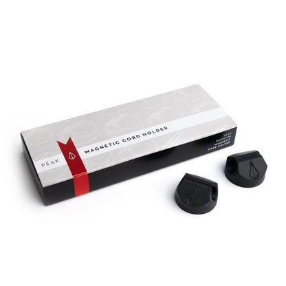 Box of Magnetic Cord Holders with two holders out of box on white background, thumbnail size