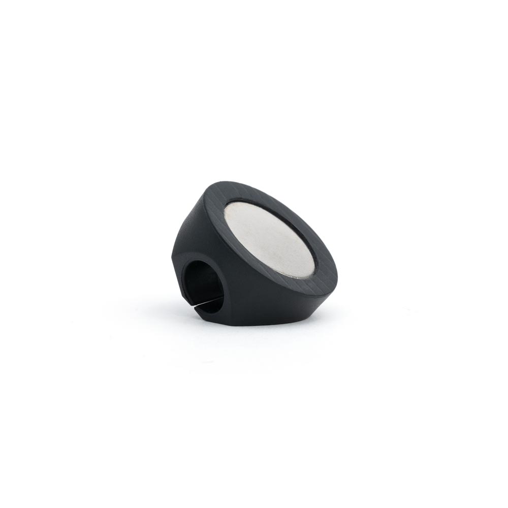 Bottom magnet on underside of Magnetic Cord Holder on white background